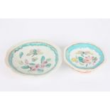 Two 19th century Chinese plates, decorated with enamel flowers and a butterfly, one with larger