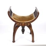 A Victorian ivory inlaid horse shoe shaped piano stool with padded seat, the frieze inlaid with