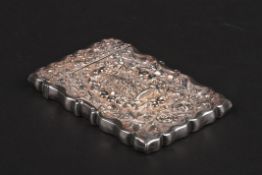 A Victorian repoussé silver 'castle top' calling card case hallmarked Birmingham 1898, decorated