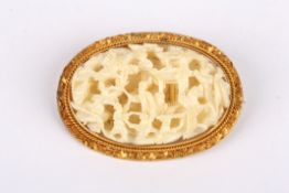 A 19th Century Chinese Canton carved ivory brooch the three dimensional carving detailing an