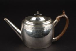 A George III oval silver teapot hallmarked London 1799, with banded decoration and engraved