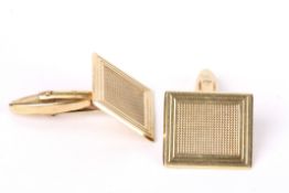 A pair of 9ct gold hallmarked rectangular cufflinks with engine turned decoration. Associated box.