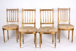 Four 19th Century Louis XVI style giltwood dining chairs the square backs with turned finials and