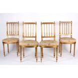 Four 19th Century Louis XVI style giltwood dining chairs the square backs with turned finials and