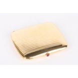 An elegant Art Deco Continental 18ct gold cigarette case of ribbed design having a pink cabochon
