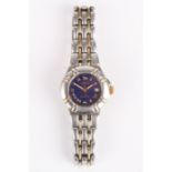A ladies Krieger quartz wrist watch the blue dial with gilt Roman numerals and date aperture, on a