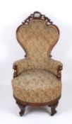 A large pair of Victorian rosewood revolving armchairs with finely carved show wood frames,