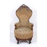 A large pair of Victorian rosewood revolving armchairs with finely carved show wood frames,