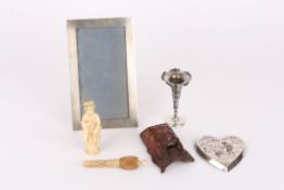 A collection of assorted items including a silver photograph frame, silver repoussé pin tray, a