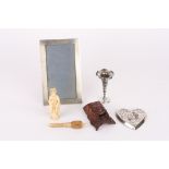 A collection of assorted items including a silver photograph frame, silver repoussé pin tray, a