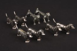 Four pairs of silver plated dog knife rests comprising a pair of bulldogs and three pairs of