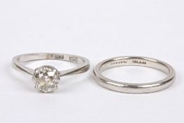 A single stone diamond set ring in platinum mount approx. 0.75 ct. and a matching platinum wedding
