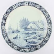 A large modern pair of Dutch Delft blue and white chargers produced by Boch, both decorated with