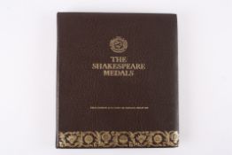 The Shakespeare Medals A set of 38 First Edition silver gilt medallions commemorating the William