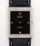 An 18ct white gold and diamond Rolex Cellini mechanical wrist watch c.1975, the rectangular black