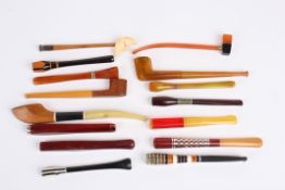 A collection of fifteen 1930s cigarette holders of various shapes and designs. Condition: