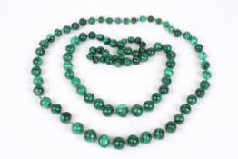 Two very large polished malachite graduated bead necklaces. (2) Approx. length 68 cm.Condition: