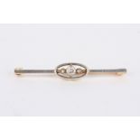 A gold, platinum and diamond bar brooch set with diamond weighing approx. 0.14cts, in unmarked
