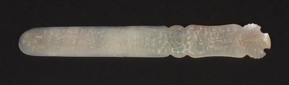 A Chinese carved mother of pearl paper knife finely carved all over with Chinoiserie scenes of