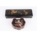 A Japanese black lacquer glove box decorated in gilt with a bird on a branch, together with