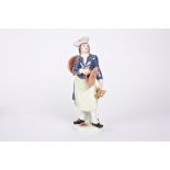 A 20th century Meissen porcelain figure of a laundry man holding a cauldron over his shoulder and