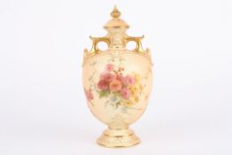 A Royal Worcester blush ivory vase and cover, with rich gilt highlights and decorated with