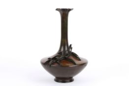 A late 19th Japanese bronze baluster vase decorated with applied leaves with flared neck and bulbous