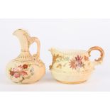 Two Royal Worcester blush ivory jugs, one with slender neck and scrolled handle, the other of