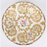 A 20th century Meissen porcelain dish painted with flowers surrounded by rich gilt floral