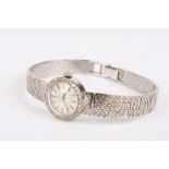 A ladies Omega 18ct white gold and diamond mechanical wrist watch the silvered dial with baton