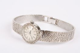 A ladies Omega 18ct white gold and diamond mechanical wrist watch the silvered dial with baton