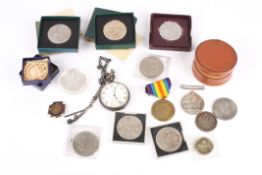 A collection of assorted silver and base metal crowns and other coins together with a WWI and WWI