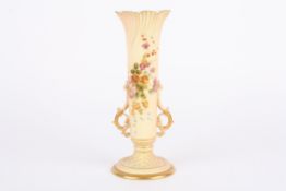 A large Royal Worcester blush ivory spill vase with twin scrolled handles and decorated with