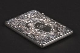 An Edwardian silver repoussé calling card case hallmarked Birmingham 1902, decorated with a highland