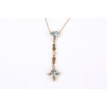 An Edwardian aquamarine and pearl set drop pendant necklace the oval aquamarine pendant in pearl set