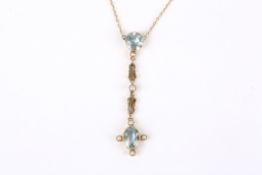 An Edwardian aquamarine and pearl set drop pendant necklace the oval aquamarine pendant in pearl set