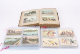 A large collection of assorted early 20th century postcards with subjects including landscapes,