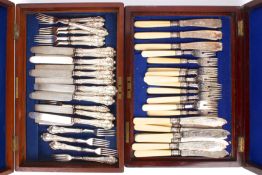 Two canteens of silver cutlery in mahogany canteens together with a silver sauce boat, hallmarked