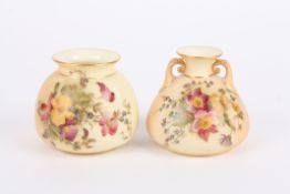 Two Royal Worcester blush ivory vases, one with two small scrolled handles, both decorated with
