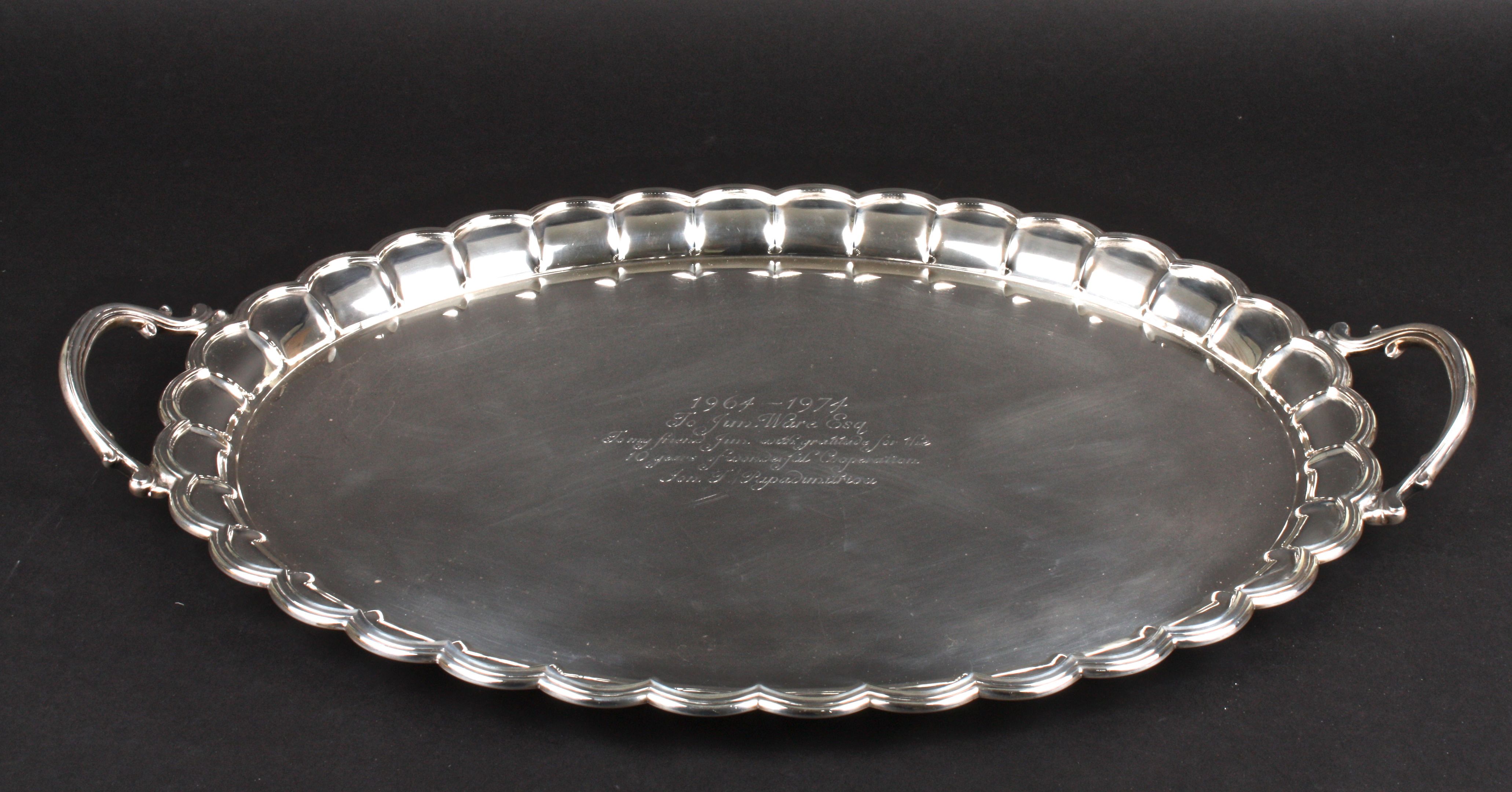 A large and heavy silver oval presentation tray hallmarked Mappin and Webb Birmingham 1994, with pie