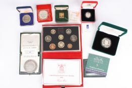 A group of assorted coins and medallions comprising: a two pound coin, Philympia 1970, a £1 silver