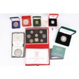 A group of assorted coins and medallions comprising: a two pound coin, Philympia 1970, a £1 silver