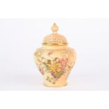 A Royal Worcester blush ivory potpourri vase decorated with flowers, numbered H279 to the base. 13cm