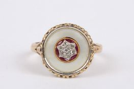 An Art Deco ruby and diamond set ring (converted from a dress stud), the mother of pearl roundel set