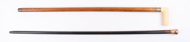 A 9ct gold topped walking stick with ebonised shaft together with an ivory handled walking stick