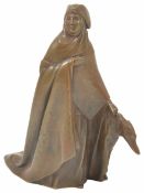 A bronzed figure of a lady wearing a full length cloak and tri-form hat, holding a standing