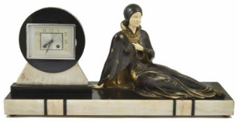 A 1930s Art Deco mantel clock decorated with a reclining lady with ivorine face and hands, the clock