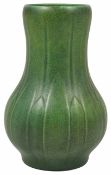 A Pilkingtons Royal Lancastrian crackle green glazed vase moulded with stylised leaf design, impress