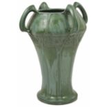 An Amphora Art Noveau four handled pottery vase the waisted body decorated with stylised tree and