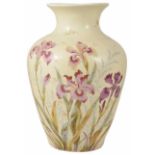 A Victorian blush ivory baluster vase painted with colourful sprays of iris flowers and leaves, each